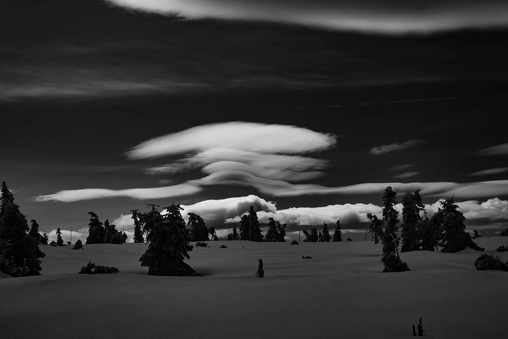 Fine art photography Karkonosze Mountains by Ziggy Kańczukowski, a black and white landscape featuring trees and clouds.