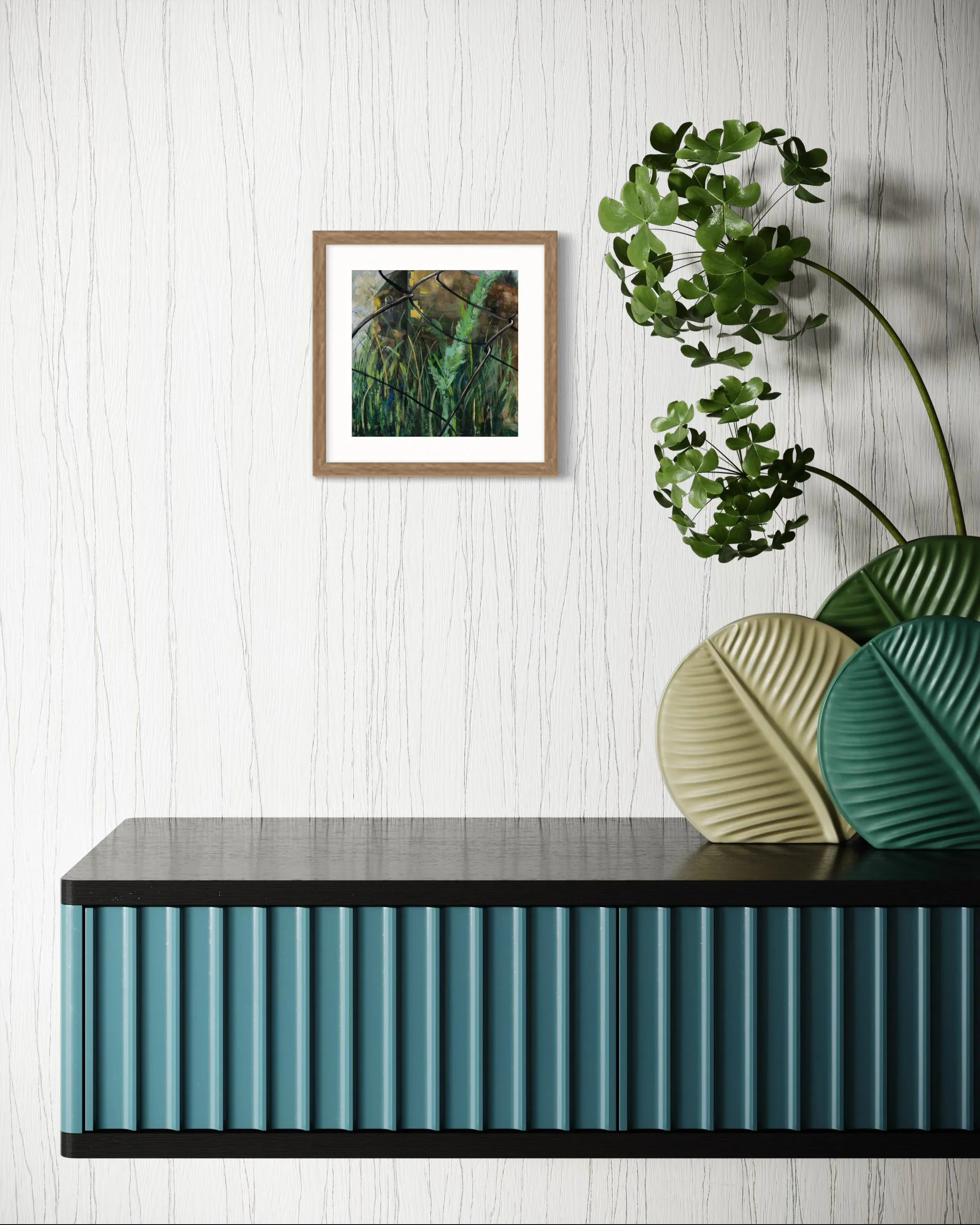 Framed abstract painting Nature III by Oliwia Tomczak displayed on a wall above a console table with decorative plants.