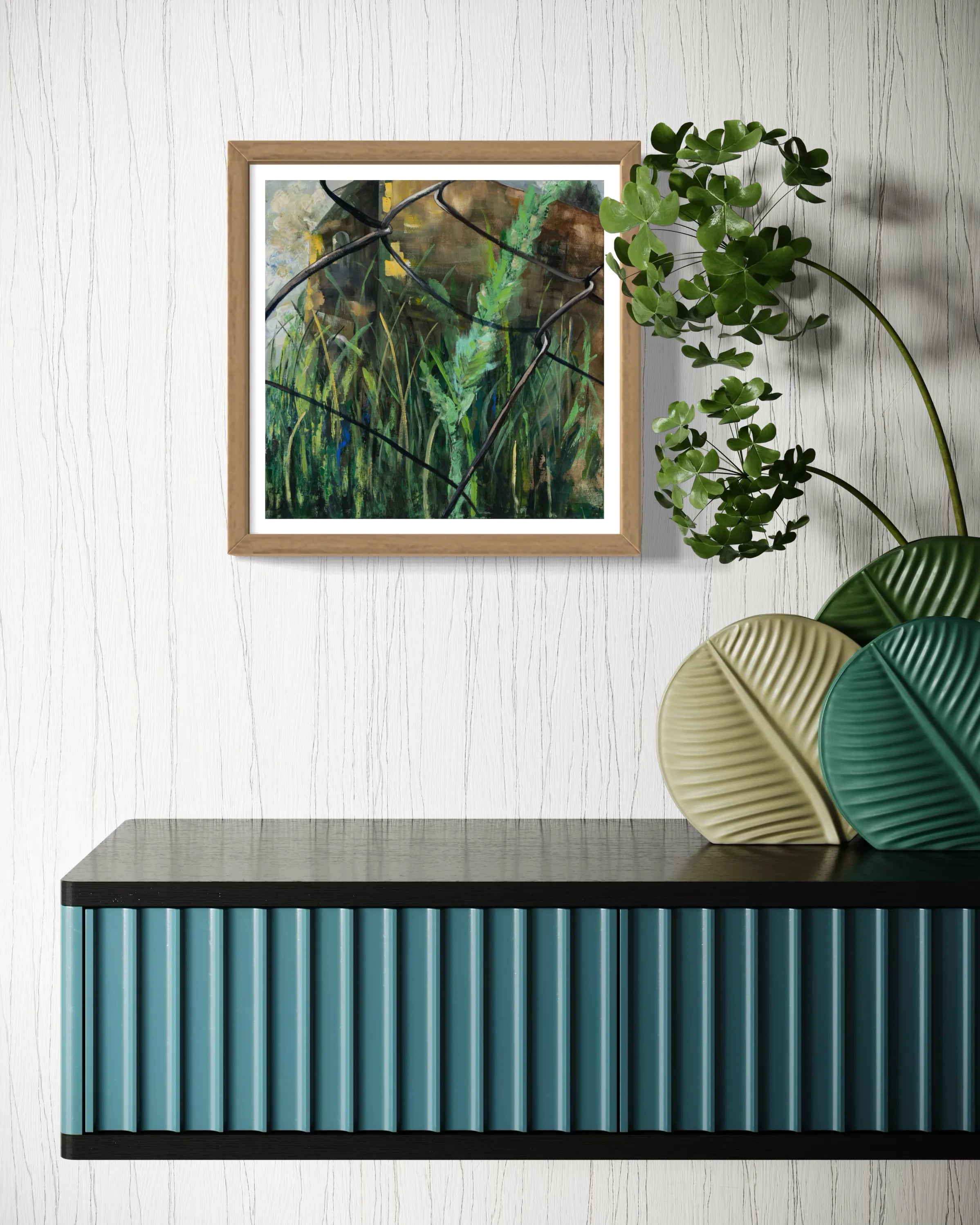 Framed abstract painting Nature III by Oliwia Tomczak displayed on a wall above a console table with decorative plants.