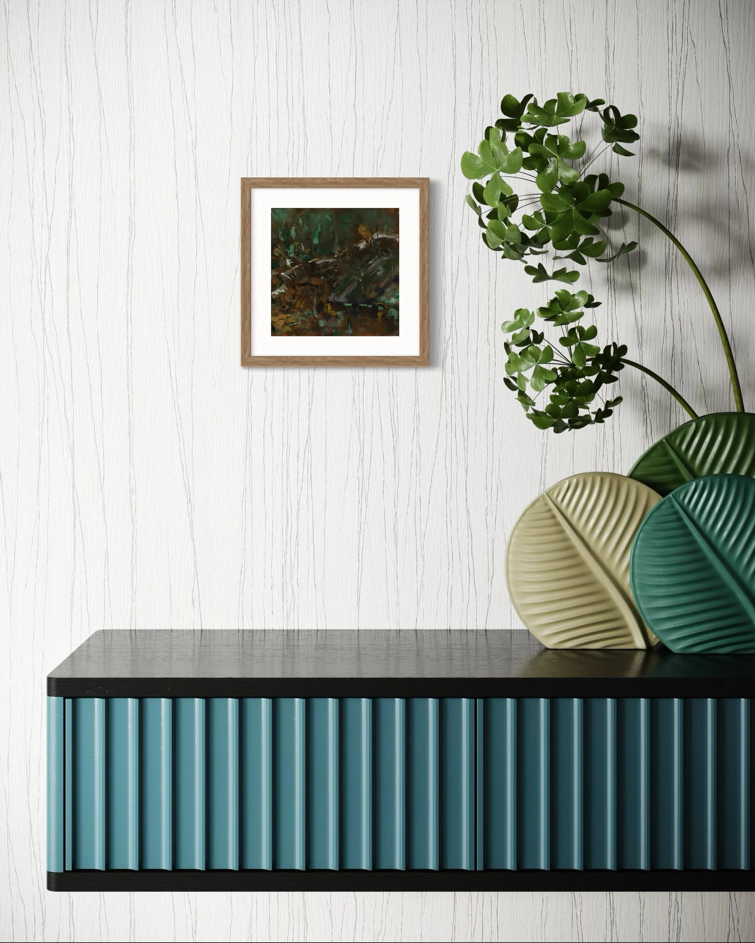 Framed abstract painting Nature IV by Oliwia Tomczak displayed on a wall above a console table with decorative plants.