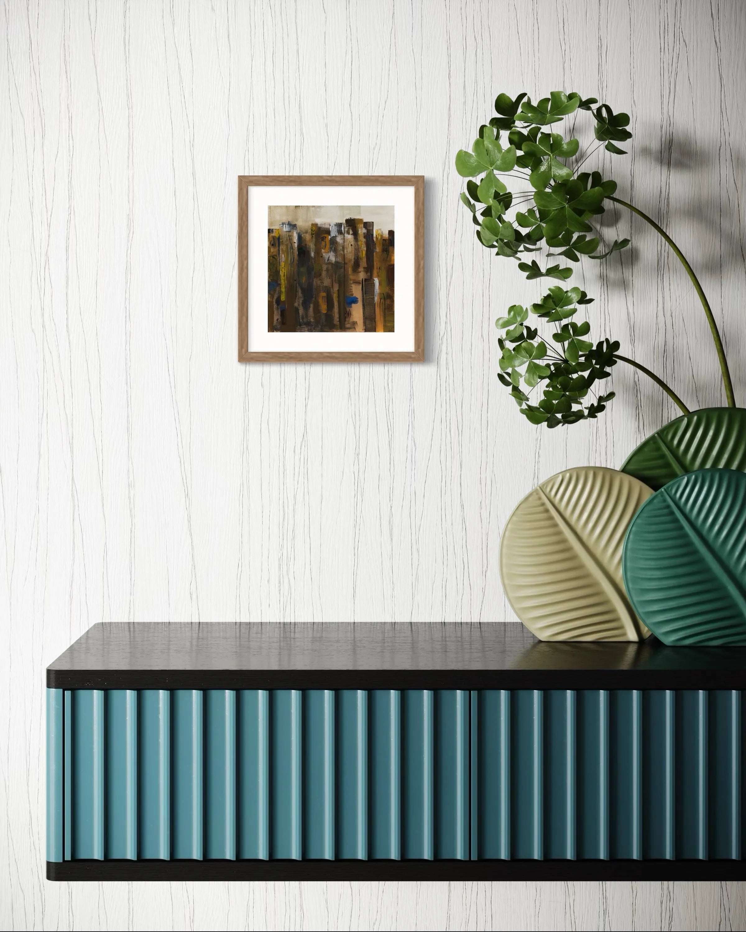 Framed abstract painting Nature I by Oliwia Tomczak displayed on a white wall above a decorative console table with blue accents.