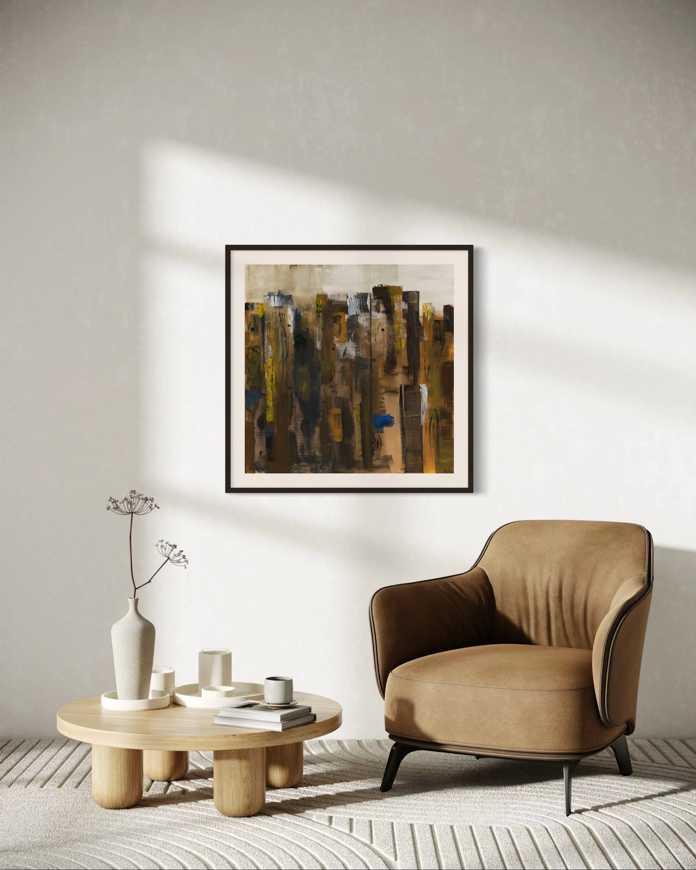 Framed abstract painting Nature I by Oliwia Tomczak displayed on a wall in a modern living room with a beige armchair and a wooden coffee table.
