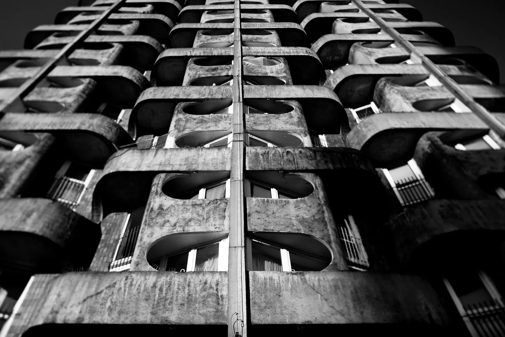 Fine art photography Structure 04 by Ziggy Kańczukowski featuring a close-up of a concrete building facade with geometric patterns.