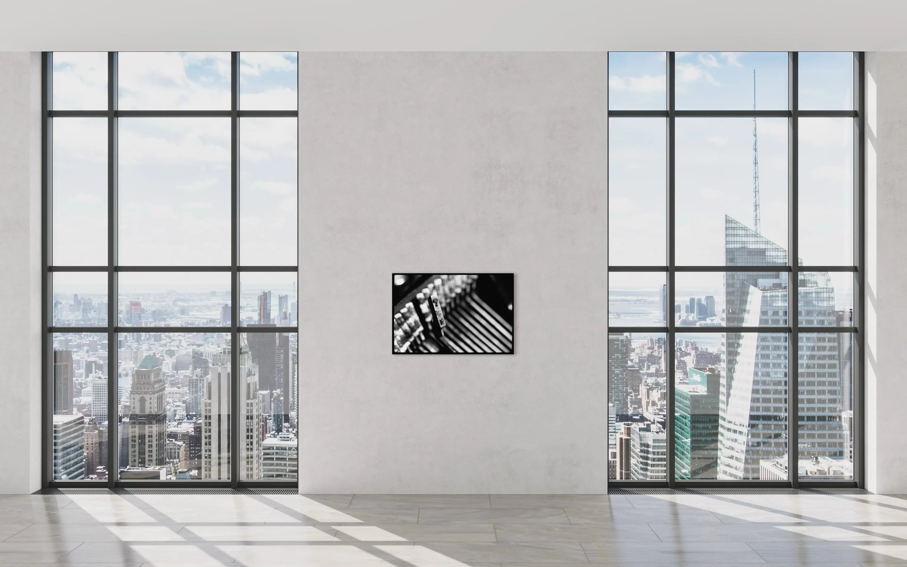 Framed fine art print Machine 03 by Ziggy Kańczukowski displayed on a wall in a modern room with large windows showing a cityscape.