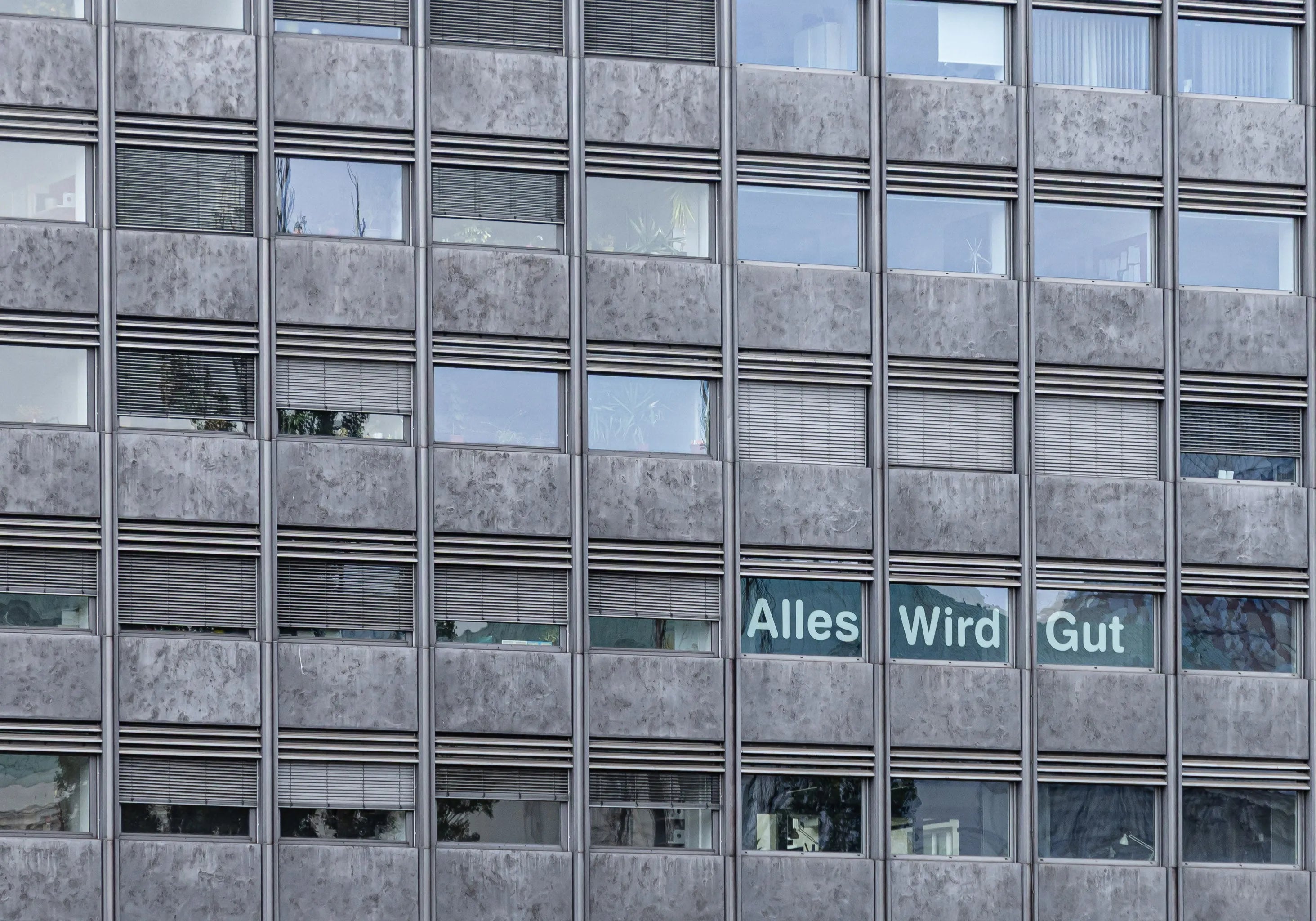 Fine art photography Structure 03 by Ziggy Kańczukowski capturing a building facade featuring the text phrase 'Alles Wird Gut'.