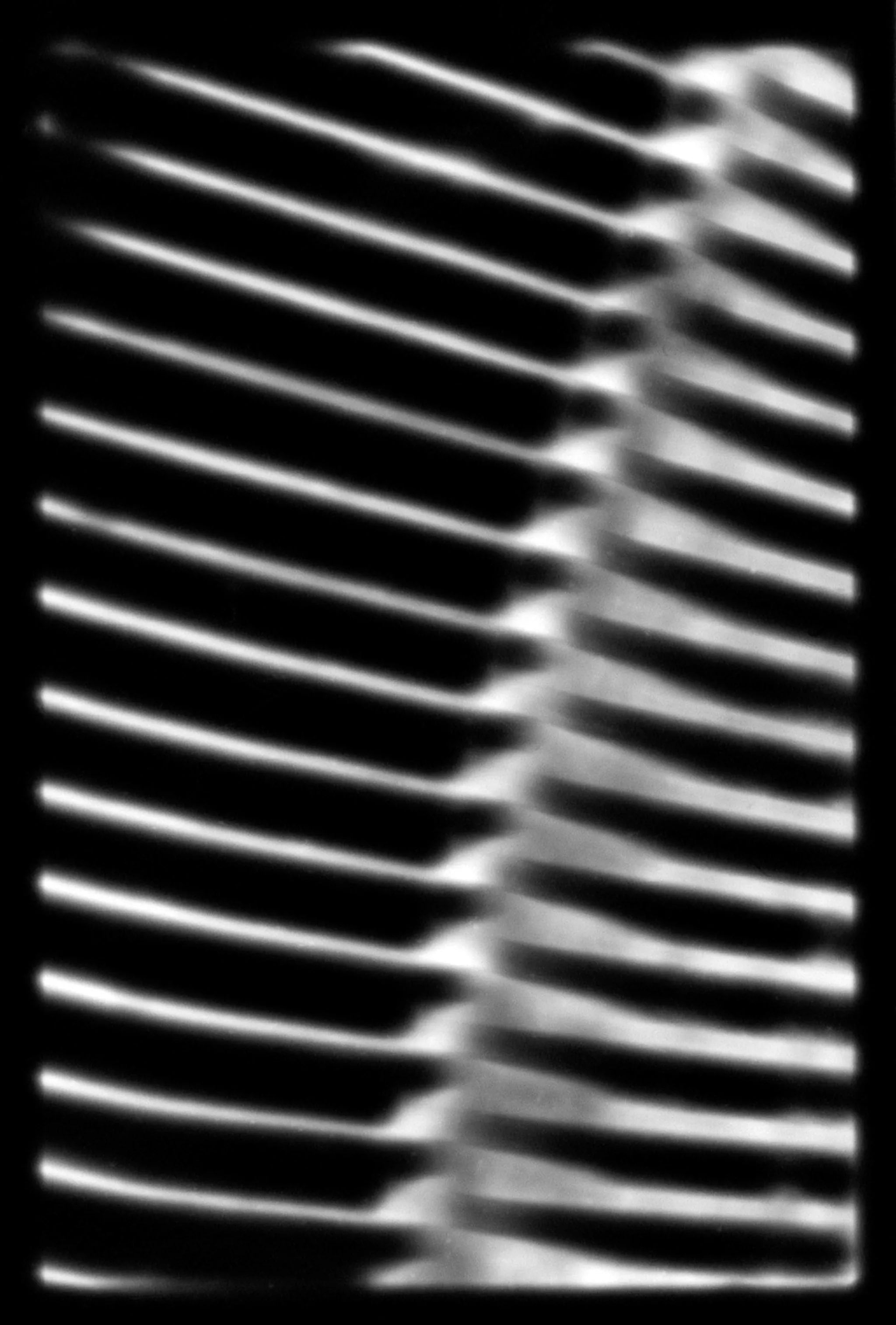 Set of wrenches arranged in a grid pattern on a white background