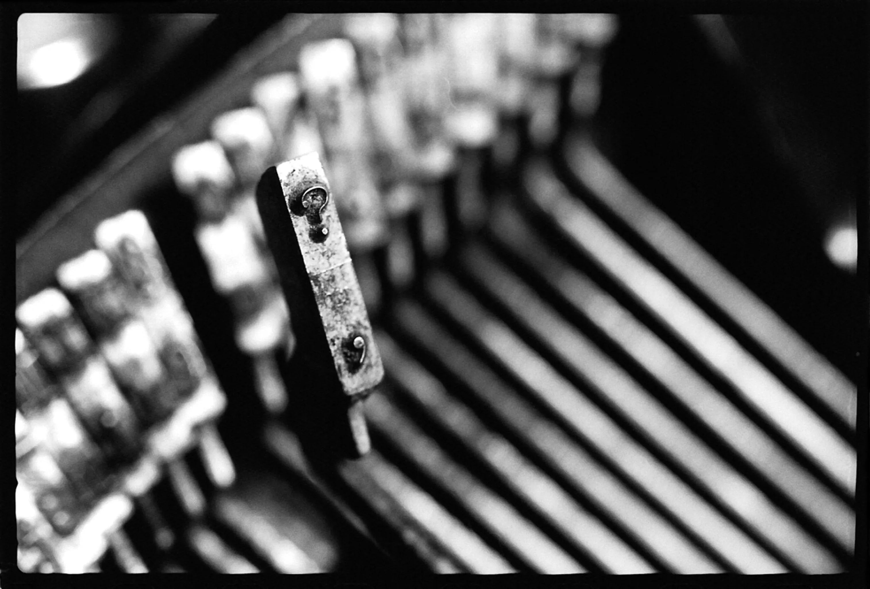 Fine art photography Machine 03 by Ziggy Kańczukowski featuring a close-up of a vintage typewriter detail with a blurred background.